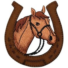 a horse's head is shown in the center of a horseshoe shaped applique