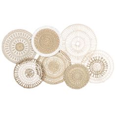 several woven baskets are arranged on top of each other, one is white and the other is beige