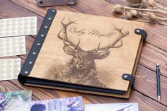 a wooden notebook with an image of a deer on it