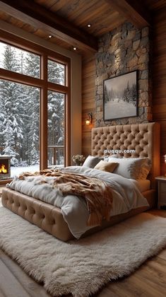 a large bed sitting in the middle of a bedroom next to a window filled with snow