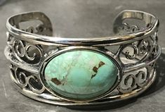 "THIS IS A STERLING SILVER 6inch Long x 1 inch at center HEAVY CUFF. IT HAS OPEN FILAGREE AS A PATTERN ON EACH SIDE. A 18 x 25mm VINTAGE ROYSTON CABOCHON IS SET AT THE CENTER. THE TOTAL WEIGHT OF THE BRACELET IS 167. cts. ETSY #SB-016 IT COMES GIFT BOXED AND WITH A SELVYT 5\"x 5\" POLISHING CLOTH. ** READY FOR GIFT GIVING**" Handcrafted Bracelets, Cuff Bracelet, Turquoise Bracelet, Cuff Bracelets, Jewelry Bracelets, Cuff, Turquoise, Things To Come, Sterling Silver