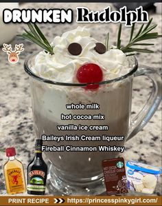 a drink with whipped cream and cherries in it