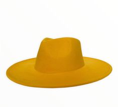 SAVANNAH WIDE BRIM FEDORA - YELLOW Introducing our new Savannah line of fedoras, which feature a highly requested large brim and a drop shaped crown. Handcrafted from a blend of wool and polyester materials Adjustable inner-headband to ensure the perfect fit Features a larger 3.75" brim Available in sizes: Medium 54-58cm and Large 58-60cm. FREE shipping on every order Flat Brim Fedora For Party, Party Fedora With Flat Brim, Spring Beach Felt Hat With Flat Crown, Spring Fedora With Flat Crown, One Size, Western Style Solid Fedora For Spring, Spring Fedora With Flat Crown, One Size Fits Most, Spring Fedora With Flat Crown, Spring Western Fedora, Wide Brim Top Hat For Spring