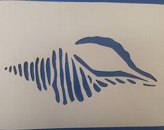 a blue and white drawing of a wave on a sheet of paper with lines drawn across it