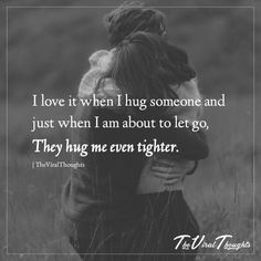 two people hugging each other in a field with the words i love it when i hug someone