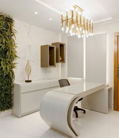 a modern office with white marble walls and flooring, an elegant chandelier hangs from the ceiling