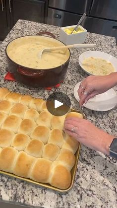 a person is making bread in the kitchen with other food items on the counter top