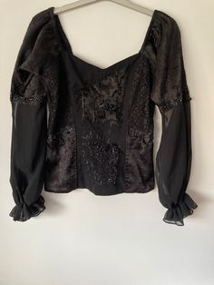 Rare blouse, in various fabric textures, patchwork lace appliqués and stonework. Elegant Fitted Blouse With Patchwork, Elegant Long Sleeve Embroidered Lace Top, Elegant Fitted Patchwork Tops, Elegant Fitted Tops With Patchwork, Party Lace Patchwork Blouse, Party Blouse With Lace Patchwork, Party Lace Blouse With Lace Patchwork, Lace Patchwork Tops, Elegant Patchwork Tops For Fall