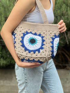 Did you choose a unique gift for her? This vintage style pouch bag for women will be a cute gift for her or your beloved ones. They ll gonna love to wear this very well made bag every day!  This crochet evil eye bag will be your favorite accessory which you ll love to wear every day. I crochet the evil eye pattern which is the one of the strongest ancient charms. It will take all eyes on. Will bring luck and give protection from bad malicious.  Are you looking for a large granny square handbag? Granny Square Handbag, Crochet Evil Eye, Large Granny Square, Evil Eye Bag, Square Handbag, Cute Gifts For Her, Crochet Pouch, Handbag Vintage, Crochet Mandala