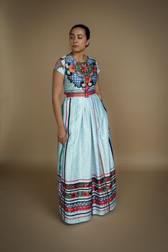 Based in: México The Talavera Capsule Collection, first introduced in 2019, returns with a limited selection available to order through our collaboration with Nayibi. This collection draws inspiration from the traditional art of Talavera, a centuries-old technique for crafting earthenware and enameled tiles renowned for its intricate, hand-painted patterns and rich colors. Characterized by vibrant blues and greens, each piece is carefully crafted by hand using locally sourced clay, reflecting th Mexican Inspired Dress, South American Fashion, Square Skirt, Mexican Folklore, Mexico Fashion, Painted Patterns, Graceful Movement, Talavera Pottery, Mexican Culture