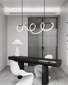 a modern dining room with black and white furniture