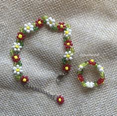 the beaded bracelet has been made with beads and other things that are attached to it