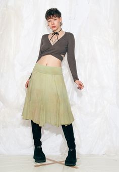 Reworked Y2K vintage midi skirt in overdyed green. We even added little bows to the waist. Made in Italy Recommended size: EU 36-40 Features: - stretchy waist - 100% cotton - dobule-layered - reworked Every item we manage is cleaned and, when necessary, repaired, ensuring it arrives to you in top condition. Our model, Panna is 171 cm / 66.7" tall and she's a size S. Size: One size / US null / UK null / IT null Measurements:  waist (seam to seam) (min): 36 cm / 14.0" waist (seam to seam) (max): 4 Frilly Skirt, Fairycore Grunge, Y2k Vintage, Vintage Y2k, Favorite Outfit, Midi Skirt, Womens Skirt, Art Collection, In Italy