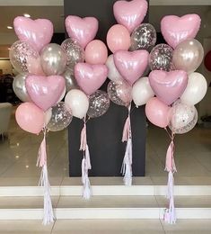 pink and silver heart balloons with tassels