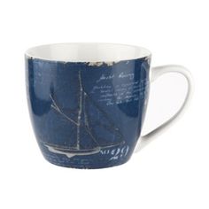 a blue and white coffee cup with a sailboat on it