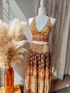 Sleeveless Two-piece Bohemian Dress, Summer Bohemian Sleeveless Sets, Bohemian Sleeveless Sets For Beach Season, Fitted Skirt Set For Beach Summer, Bohemian Fitted Beach Sets, Fitted Bohemian Sets For Summer, Fitted Bohemian Brown Crop Top, Two-piece Skirt Set For Summer Vacation, Summer Festival Hippie Skirt