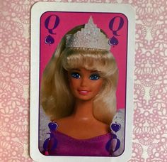 a barbie doll with a tiara on her head and blue eyes in a card