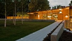 a modern house lit up at night in the evening