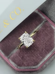 This astonishing 3.19 carats ring has a 3 carat lab grown elongated cushion cut center diamond and is IGI certified at "E" in color and "VS1" in clarity, (Excellent Cut, Polish and Symmetry) and is set in a classy solitaire hidden halo setting in 14K yellow gold. Comes with IGI certification, appraisal and our lifetime warranty as well. Elongated Cushion Engagement Rings, Elongated Cushion Engagement Ring Gold, Elongated Cushion Engagement Ring, Promise Rings For Girlfriend, Moissanite Engagement Ring Cushion Cut, Cushion Cut Solitaire, Elongated Cushion Cut, Ring Cuts, Elongated Cushion