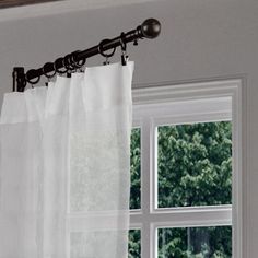 the curtain is hanging in front of the window