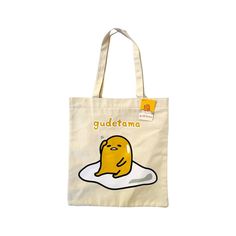 This Is A New With Tag Tote Bag Featuring Sanrio Character Gudetama. It Is Made Of A Canvas Material, And Comes With A Convenient Zipper Closure And 2 Shoulder Straps. The Bag Is Slim, Making It Ideal For Carrying Around Daily Essentials, Such As Books, Snacks, Or A Tablet. The Bag Measures Approx. 14” X 13”. Cute Yellow Shoulder Bag For Everyday Use, Yellow Kawaii School Bag, Kawaii Yellow School Bag, Cute Everyday Yellow Shoulder Bag, Cute Yellow Bag For Daily Use, Kawaii Yellow Travel Bag, Yellow Kawaii Travel Bag, Cute Yellow Shoulder Bag For Daily Use, Yellow Kawaii Style Travel Bags