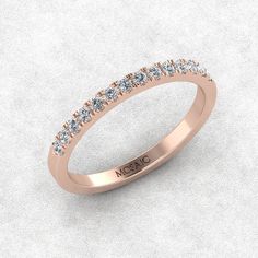 a rose gold wedding band with rows of diamonds