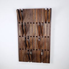 a piece of wood that has been made into a wall hanging on the side of a wall