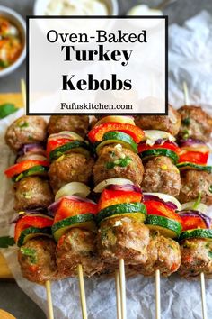 several skewered turkey kebobs with onions and peppers