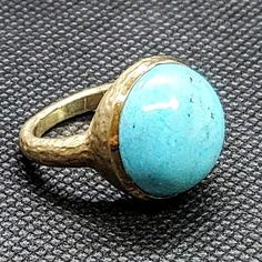 14k solid hammered yellow gold ring with 13.5 ct. 16.5 mm round shape natural spider turquoise. This item can also be ordered in rose or white gold with different color gemstones such as, green tourmaline, pink tourmaline, rutilated quartz, onyx, labradorite, white agate, all colors of chalcedony and aquamarine, please contact for a quote as each gemstone varies in price. I am a manufacturer of fine jewelry for over thirty years, loyalty & customer satisfaction has always been my ultimate go Gold Turquoise Ring With Gemstone, Gold Turquoise Ring For Anniversary, Turquoise Ring With Bezel Setting, Handmade Yellow Gold Turquoise Ring, Handmade Turquoise Ring In Yellow Gold, Elegant Turquoise Ring With Bezel Setting, Elegant Gold Turquoise Round Ring, 14k Gold Turquoise Round Ring, 14k Gold Turquoise Ring