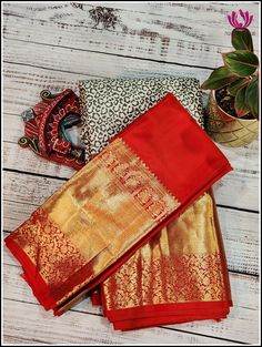 This very contemporary designer pure kanchipuram saree is crafted in Black and white boasting with animal skin design throughout the body and a korvai grand reddish orange pallu is adorned with paisley, strips,khumba and floral motifs, this saree features a beautiful korvai reddish orange 12inch border on one side and a smaller border on the other side with khumba ,florals and bird motifs. This saree comes with a designer look blouse piece in reddish orange with big border matching the border an Festive Saree With Border For Rituals, Ceremonial Red Katan Silk Saree, Traditional Wear With Border For Diwali Rituals, Traditional Wear For Diwali With Border Details, Traditional Wear For Diwali Rituals With Border Details, Traditional Drape Saree With Border For Rituals, Traditional Wear With Border For Rituals And Festivals, Rituals Saree With Border, Red Ceremonial Saree With Zari Weaving