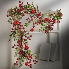 a white shelf with christmas decorations on it