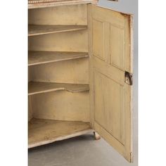 an open wooden cabinet with shelves and doors on the front, in white painted wood