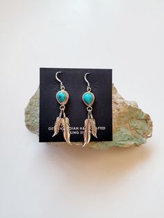 These are a great pair of southwest earrings. These are Navajo handmade they are signed and stamped on the back of the earrings. The artist has used Kingman turquoise that is mined in Kingman Arizona. They have then hung 2 sterling silver feathers that hang down from the stone. These earrings are very light weight and comfortable to wear. The length of the earrings are 2 1/2 inches the width is 1/2 inch. Please message me with any questions you may have. Bohemian Concho Earrings As Gift, Artisan Concho Earrings As Gift, Southwestern Style Drop Earrings As Gift, Bohemian Turquoise Earrings Stamped 925, Concho Dangle Earrings For Gift, Southwestern Style Drop Earrings, Handmade Southwestern Drop Earrings, Adjustable Turquoise Concho Earrings, Bohemian Concho Drop Earrings