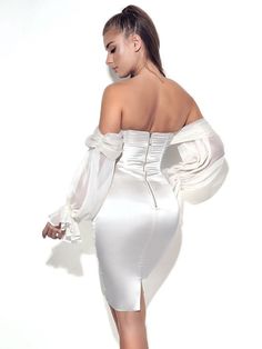 Turn the glamour on with our off the shoulder pearl white Lydia! Cut from a glowing pleated luxurious silk and double duchess satin, this dress will have you ready to impress. Featuring a built-in corset with lightly padded cups and dramatic draping puff sleeves. Feel like a total bombshell and pair with sky-high heels to finish off the look! Material: Double Duchess Luxe Satin / Pleated Silk / Boned Corset Length: Approx 32.2 inch / 82 cm Stretch Factor: Low Stretch Clean: Dry-clean only Model Off Shoulder Puff Sleeve Dress, Off Shoulder Puff Sleeve, White Satin Dress, Shoulder Puff Sleeve, Tie Dye Jumpsuit, Puff Sleeve Dress, Maxi Dress Cocktail, Sparkly Dress, Puff Sleeve Dresses