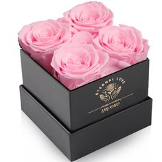 a black box with pink roses in it