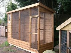 a chicken coop in the middle of a yard