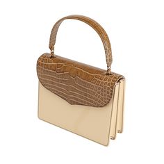 Isabella is crafted in natural vegetable-tanned leather with an authentic alligator flap, exuding classic elegance and modern flair. This versatile handbag features high-quality Natural Vachetta for the main body, gussets, and back body, offering a luxurious and timeless appeal. The Cafe Glossy alligator top flap adds a distinctive touch, giving it a sophisticated and exotic look that stands out. Handcrafted by generational artisans, Isabella is designed to seamlessly transition from day to night, making it the perfect companion for any occasion. Luxury Leather Trim Flap Bag, Luxury Leather Structured Flap Bag, Luxury Timeless Textured Leather Flap Bag, Luxury Textured Leather Timeless Flap Bag, Chic Luxury Flap Bag With Brass Hardware, Tan Handbags, Body Top, The Cafe, Leather Conditioner