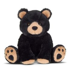 a black and brown teddy bear sitting down