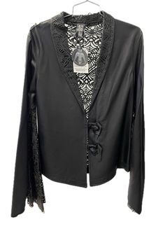 This leather jacket with mesh details on the collar, sleeve edges, and back is a swanky style move. Whether you go for regular or flared sleeves, it's all about your vibe – classic elegance or a more dynamic look. Those cool details bring a touch of charm and sophistication, making this jacket perfect for standout occasions.Size M Made in US Vibe Classic, Classic Elegance, Flared Sleeves, Leather Jacket, Mesh, Collar, Leather