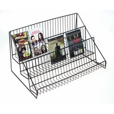 a wire magazine rack with magazines in it