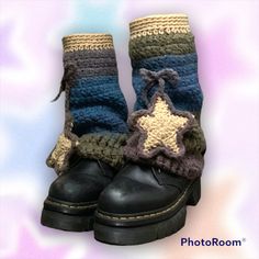 a pair of boots with crocheted stars on them