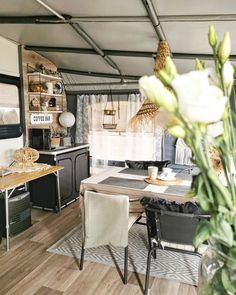 the interior of a camper is clean and ready to be used as a kitchen