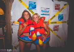 two women in life vests standing next to each other