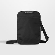 NOMATIC makes travel as painless as possible with this thoughtfully designed pouch. Constructed of water-resistant fabric in classic black, the bag offers durability, organization and easy access to essentials. The sling wears crossbody or over the shoulder for comfortable carrying, while an RFID-safe pocket and tamper-proof zippers provides security as you go about your day-to-day or explore the world.   • Durable, water-resistant materials  • Tamper-resistant zippers  • 2 carrying options: ove Luggage Accessories, Water Resistant Fabric, Explore The World, Water Proof, Crate And Barrel, Travel Luggage, Easy Access, Travel Bags, Classic Black