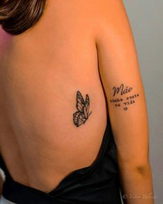 a woman with a butterfly tattoo on her back