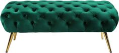 a green tufted bench with gold legs