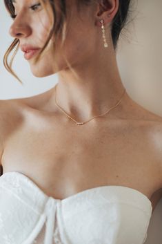 Simple, effortless, dainty pendant perfectly designed to go with a wedding gown or with jeans and a tee for date night. Dainty Gold Necklace For Evening, Dainty Tarnish Resistant Wedding Necklace, Dainty 14k Gold Filled Necklace For Wedding, Delicate Tiny Wedding Necklaces, Minimalist Open Heart Wedding Necklace, Dainty Pendant, Base Metal, Wedding Gown, Crystal Necklace