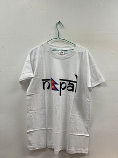 Nepal flag tshirt Band Logo Cotton T-shirt For Festival, White T-shirt With Text Print For Independence Day, Flag Of Nepal, Independence Day Flag Print T-shirt For Streetwear, Nepal Flag, Dhaka Fabric Nepal, Prayer Flags, Flag Tshirt, Nepal