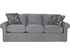 a gray couch with leopard pillows on it