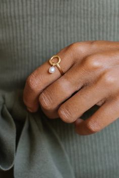 A classic gold-filled ring with a pearl accent, Celina Pearl Ring is considered a pearl of wisdom due to its perfect mix of traditional and modern. 2 Pearl Ring, Everyday Gold Pearl Drop Ring, Everyday Gold Pearl Ring With Pearl Drop, Gold Everyday Pearl Ring With Pearl Drop, Everyday Gold Ring With Pearl Charm, Minimalist Gold Pearl Ring With Detail, Gold Minimalist Pearl Ring, Delicate Gold Ring With Pearl Charm, Delicate Gold Rings With Pearl Charm